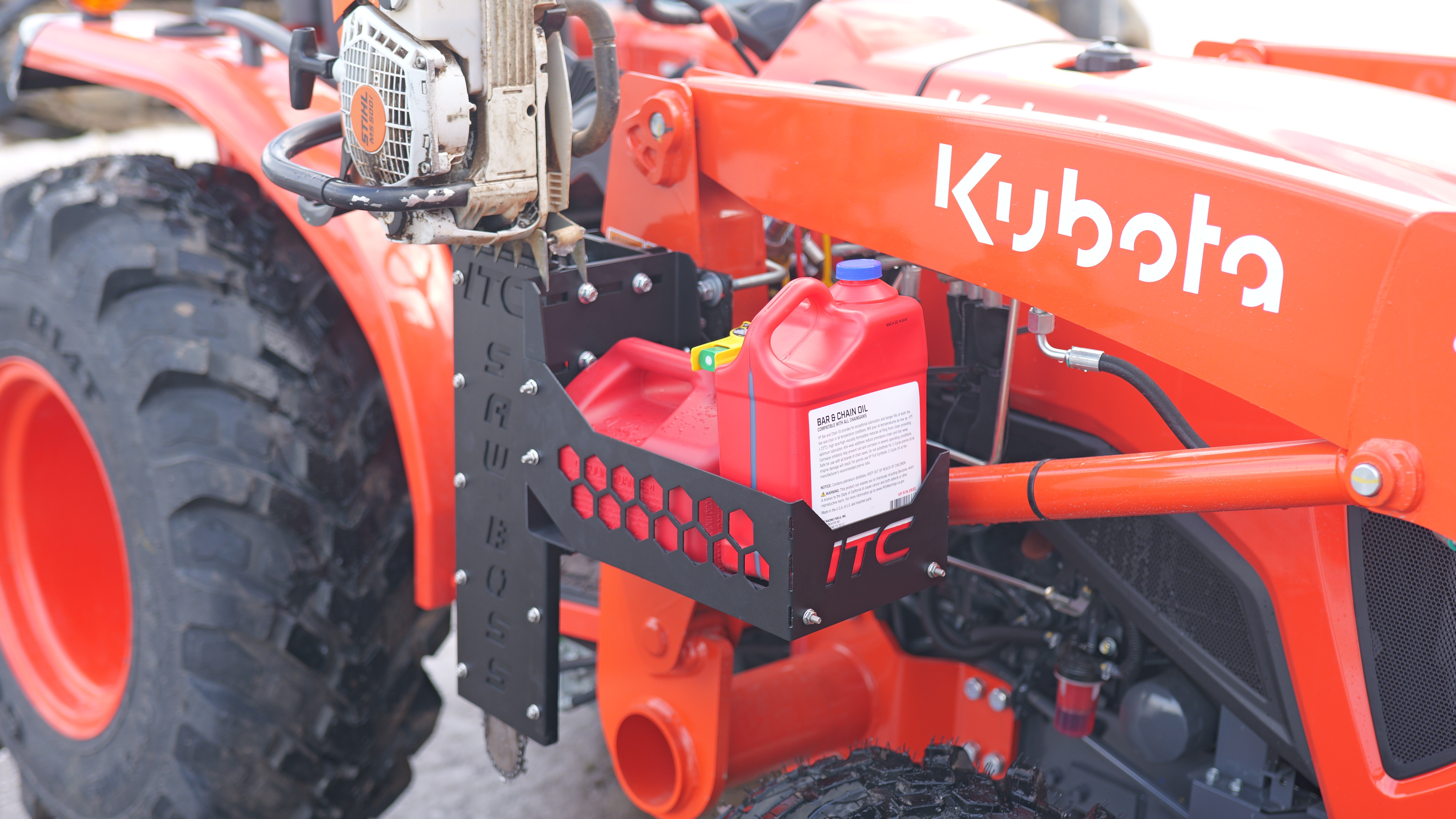 ITC Saw Boss chainsaw carrier mounted on a tractor loader